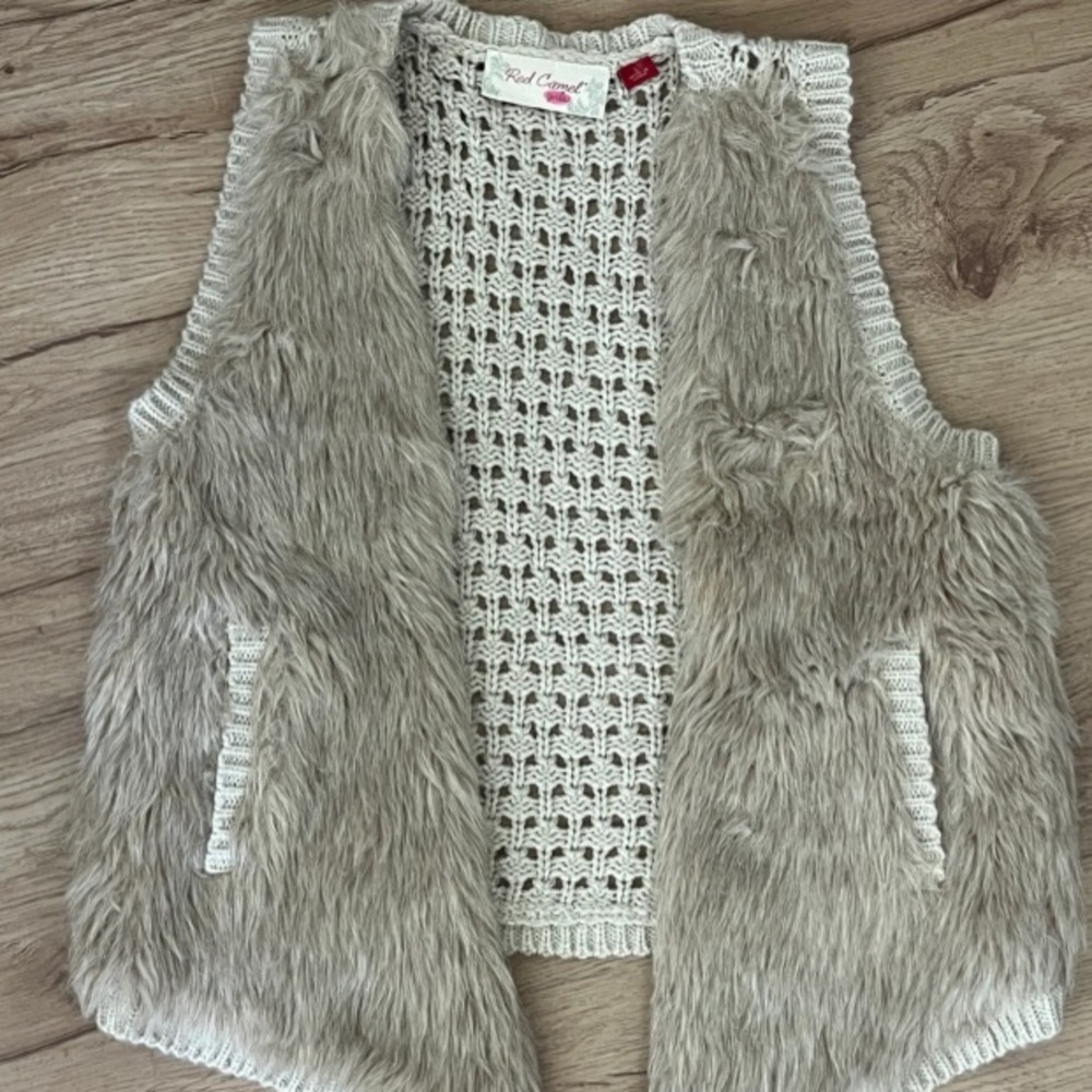 Beautiful girls size large fur vest color creamy/tan Preowned $20.00